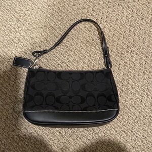 Small Coach Purse, bought new and hasn’t been worn. Still has original tags.